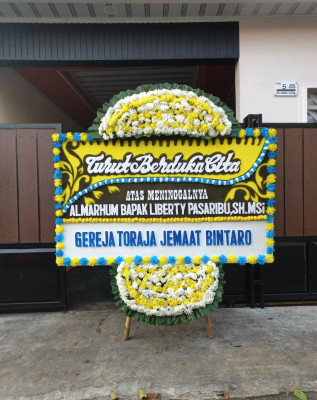 Papan Bunga Duka di Sakra